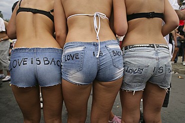 Three giils behind at the loveparade in Berlin, Germany Europe