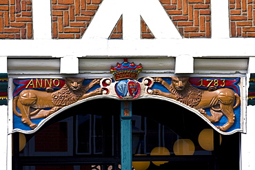 Coat of arms and lions adorning the timber framed or timber-frame town hall building in Jork, Altes Land, Lower Saxony, Germany, Europe