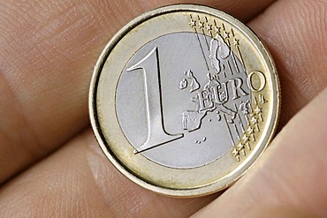 1 Euro coin in a hand