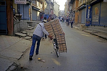 Nepalese man bringing eggs to the market, Kathmandu, Nepal, Asia