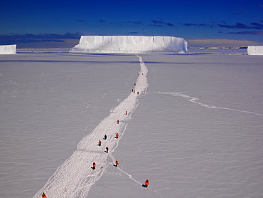 Hike over sea ice to a big iceberg in front of Cape Washington, Ross Sea, Antarctic