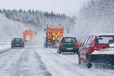 Road service in winter snowploughs on highway Bavaria Germany