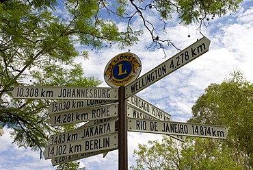 Signpost showing kilometer distances to various directions, Alice Springs, Northern Territory, Australia