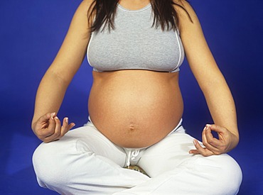 Pregnant woman practicing yoga