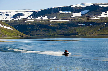 Speedboat near the village of Hesteyri, Hesteyrarfjoerâˆšâˆžur, Hesteyrarfjoerdur Fjord, Hornstrandir, Westfjords, Iceland, Europe