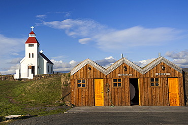 The church and a petrol station in a wooden hut, Moeâˆšâˆžrudalur, Highlands of Iceland, Iceland, Europe