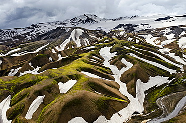 Aerial view, rhyolite mountains partially covered with snow, Landmannalaugar, Fjallabak conservation area, Icelandic Highlands, Iceland, Europe