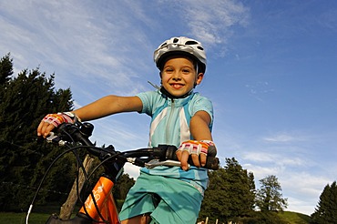 Girl, 7, riding a mountain bike