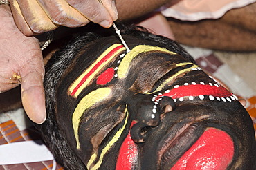 The make-up of the Kathakali character Nakrathundi is being applied, Varkala, Kerala, India, Asia