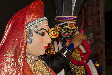 Leleda and Nakrathundi on stage at a Kathakali performance in Varkala, Kerala, India, Asia