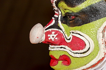 The make-up of the Kathakali character Ravana is being applied, Perattil, Kerala, India, Asia