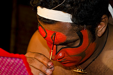 The make-up of the Kathakali character Bali is being applied, Perattil, Kerala, India, Asia