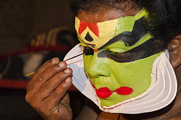 The make-up of the Kathakali character Naradan is being applied, Perattil, Kerala, India, Asia