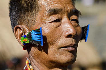 Warrior of the Kachari tribe waiting to perform ritual dances at the Hornbill Festival, Kohima, Nagaland, India, Asia