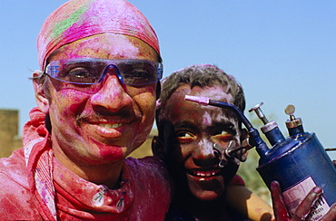 Visitors of the Holi festival, sprayed with colour powder and water, Vrindaban, Uttar Pradesh, India, Asia