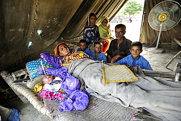 Family with newborn baby, they have been living in a tent since the flood disaster of 2010, Lashari Wala village, Punjab, Pakistan, Asia