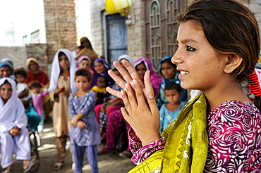 Girl participating in a hygiene campaign, instructions for handwashing, Lashari Wala village, Punjab, Pakistan, Asia