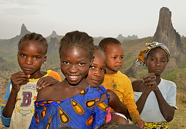 Children in front of the volcanic landscape at the village of Rhumsiki, Mandara Mountains, Cameroon, Central Africa, Africa