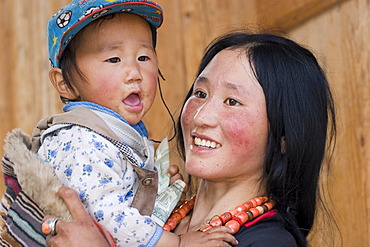 Asia, china, mother with child in monastery labrang.