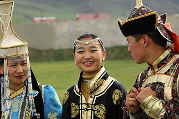 Two women and a man wearing traditional Mongolian national costumes, Ulan Bator or Ulaanbaatar, Mongolia, Asia