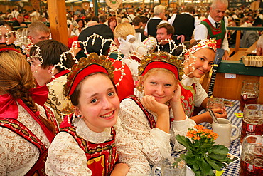 People sitting in a beer tent at an international festival for national costume, Muehldorf, Upper Bavaria, Bavaria, Germany, Europe