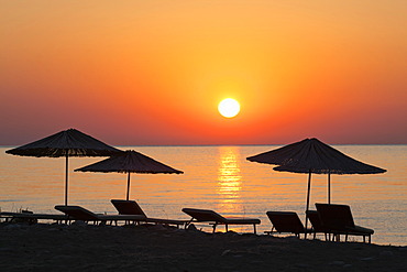 Beach chairs and sunshades on the beach at sunrise, Lycian coast, Lycia, the Aegean, Mediterranean Sea, Turkey, Asia Minor