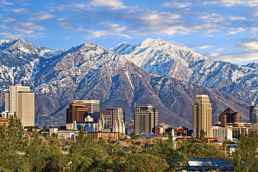 Skyline of downtown Salt Lake City with the towering Wasatch Mountain range at back, Utah, USA