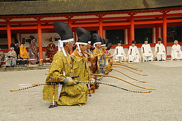 Archers at the archery ceremonial kneeling at shooting position in Shimogamo Shrine, Kyoto, Japan, Asia