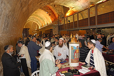 Bar Mitzvah, Jewish coming of age ritual, decorated Torah scroll on table with young man celebrating his Bar Mitzvah, Haftarah, underground part of the Western Wall or Wailing Wall, Old City of Jerusalem, Arab Quarter, Israel, Middle East