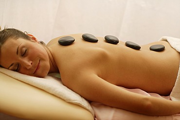 Women having a Hot Stone Massage, spa