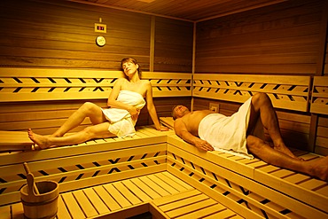 Couple in a sauna, woman, 35 years, and man, 54 years