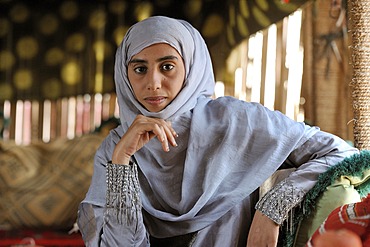 Portrait of a Bedouin woman in Wahiba Sands Desert, Oman, Middle East