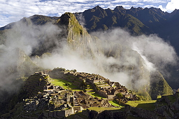 Inca ruins of Machu Picchu in the Andes, with fog, UNESCO World Heritage Site, Urubamba Valley, near Cusco, Cuzco, Peru, South America