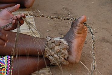 Zulu woman braiding