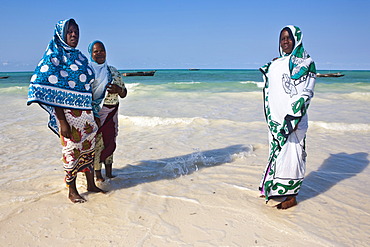 Muslim women on the beach in Zanzibar, Tanzania, Africa