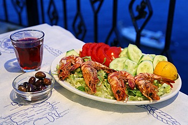 Shrimps and salad, olives and red wine, Crete, Greece