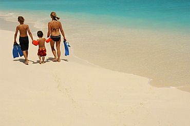 Woman and two children on the beach, Laguna Resort, The Maldives, Indian Ocean