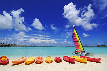 Kayaks and a catamaran on the beach, St. Regis Bora Bora Resort, Bora Bora, Leeward Islands, Society Islands, French Polynesia, Pacific Ocean