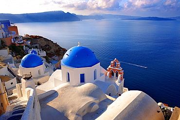 Blue domed Byzantine Orthodox churches, Oia, Ia, Santorini, Cyclades Islands, Greece, Europe