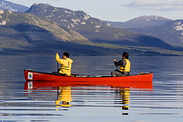 Canoeists, evening, Lake Laberge, Yukon Territory, Canada, North America