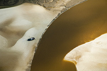 Aerial view, boat on a sand bank at a river bend, Pwani Region, Tanzania, Africa