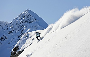 Freerider, snowboarder descending, in front of Standkopf Mountain, Sagtaler Spitze Mountain, Alpbach Valley, KitzbâˆšÂºhel Alps, North Tyrol, Austria