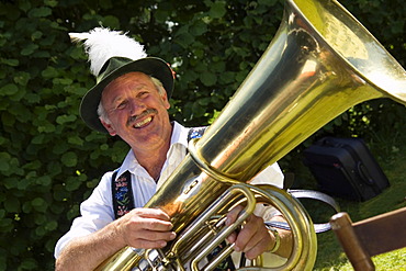 Bavarian tuba player in typical costume, Iffeldorf Upper Bavaria, Germany, MR