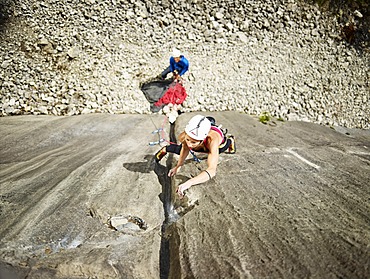 Woman lead climbing a gully, crack in the rock, Martinswand climbing area, Zirl, Tyrol, Austria, Europe