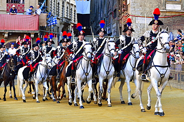 Mounted dragoons at a parade before the historical horse race Palio di Siena, Piazza del Campo, Siena, Tuscany, Italy, Europe