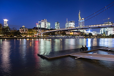 Holbeinsteg, pedestrian bridge over the Main River with a skyline at dusk, Frankfurt am Main, Hesse, Germany, Europe