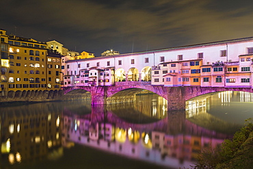 Coloured illuminated Ponte Vecchio by night, Festival of Lights, Arno, Florence, Italy, Europe