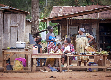 Street scene, woman at a food stall, village near the town of Campo, Southern Region, Cameroon, Africa