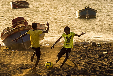 Teenager playing soccer, children, city beach of Tarrafal, São Nicolau, Cape Verde, Africa