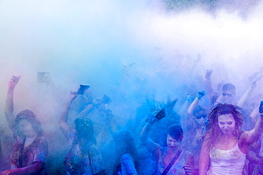 Thousands of young women and man are throwing color powder in the air at the colorful Holi festival, Dresden, Saxony, Germany, Europe